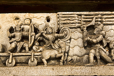 A bas relief detail showing Hoysala style warfare in the Hoysaleshvara Temple at Halebid, Karnataka, India, Asia