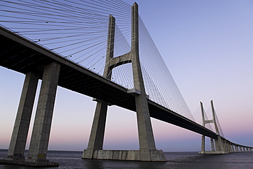 Dusk at the Vasco da Gama Bridge over the River Tagus (Rio Tejo) in Lisbon, Portugal, Europe