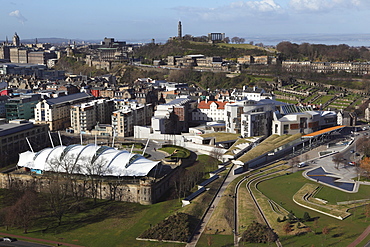 The Scottish Parliament stands in the foreground, under Calton Hill, in Edinburgh, Scotland, United Kingdom, Europe