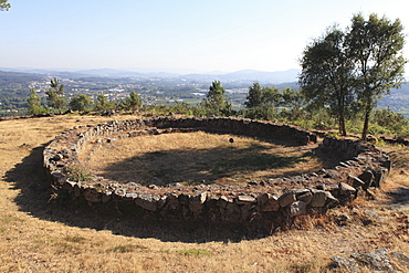 Remains of a round house in the Celtic hill settlement dating to the Iron Age at Citania de Briteiros, Minho, Portugal, Europe