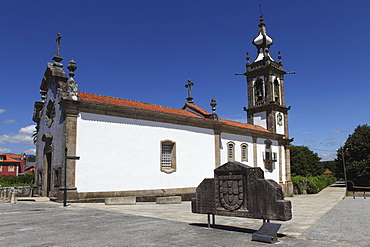 Portugal's royal coat of arms outside the 15th century Convent of St. Antonio church in Ponte de Lima, Minho, Portugal, Europe