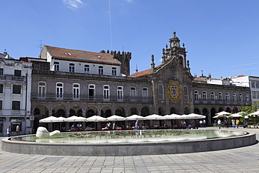 Cafes stand in front of La Arcade and Igreja da Lapa church on the Praca da Republica, Braga, Minho, Portugal, Europe