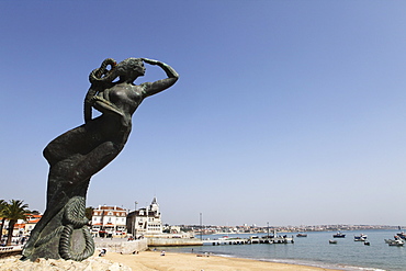 Nautical statue of a female figure looking towards the Atlantic Ocean at Ribeira Beach, Cascais, near Lisbon, Portugal, Europe