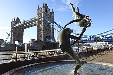 Tower Bridge and the Girl with Dolphin statue by David Wynne, by the River Thames, London, England, United Kingdom, Europe