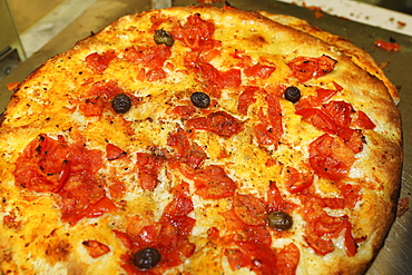 Freshly baked focaccia, a traditional dish popular in the Bari Vecchia quarter of Bari, Apulia, Italy, Europe