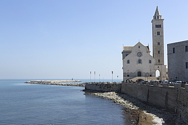 The Adriatic Sea, harbour wall and Cathedral of St. Nicholas the Pilgrim (San Nicola Pellegrino) in Trani, Apulia, Italy, Europe