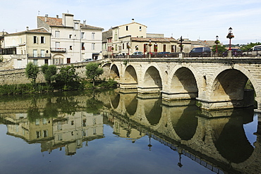 A Roman Bridge, built in the reign of the Emperor Tiberius, spans the River Vidourle at Sommieres, Gard, Languedoc-Roussillon, France, Europe