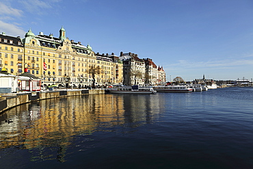 Waterfront buildings at Strandvagen, overlooking boats at Nybroviken, in Stockholm, Sweden, Scandinavia, Europe