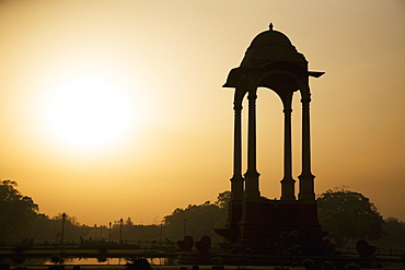 Sunrise silhouettes a chhattri in New Delhi, India, Asia