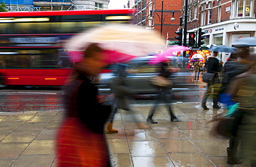 Shoppers in the rain, Oxford Street, London, England, United Kingdom, Europe