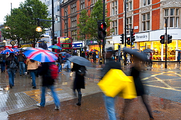 Shoppers in the rain, Oxford Street, London, England, United Kingdom, Europe