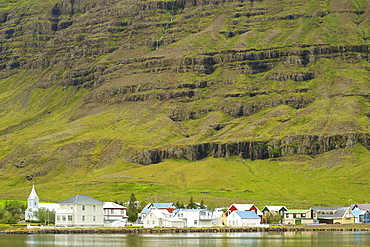 Houses and church in Seydisfjordur, a village on the shores of Seydisfjordur fjord, in the east, Iceland, Polar Regions