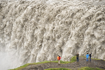 Tourists photographing Dettifoss waterfall near Myvatn in Vatnajokull National Park, northeast area, Iceland, Polar Regions