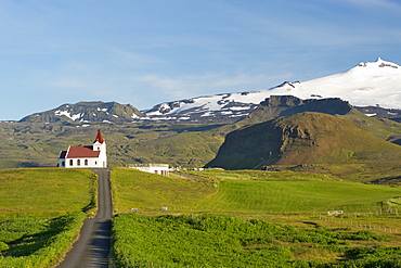 Ingjaldsholl church near Hellissandur on the Snaefellsnes peninsula in the west, with Snaefellsjokull peak on the right, Iceland, Polar Regions