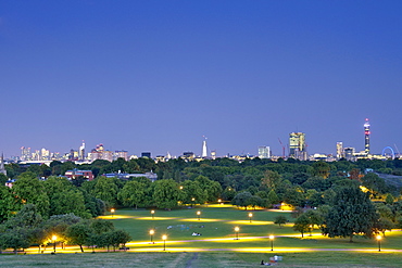 A dusk view of the London skyline from Primrose Hill showing the park, the BT tower and the London Eye, London, England, United Kingdom, Europe