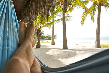 Relaxing in a hammock at Matemo lodge in the Quirimbas archipelago in Mozambique, Africa