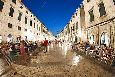 Pedestrians walking at night along Stradun, the main street in the old town in Dubrovnik, UNESCO World Heritage Site, Adriatic Coast, Croatia, Europe