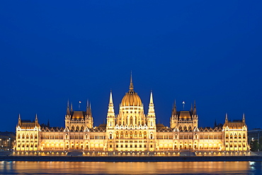 Dusk view of the Hungarian Parliament Building on the banks of the Danube River, Budapest, Hungary, Europe