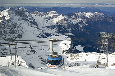 The Titlis Rotair gondola near the summit of Mount Titlis in the Swiss Alps. The gondola was the first revolving cable car in the world.