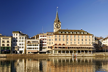 St Peter's church and buildings of the old town along the Limmat River in Zürich Switzerland.