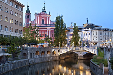 The Franciscan Church of the Annunciation and the Triple Bridge over the Ljubljanica River in Ljubljana, Slovenia, Europe