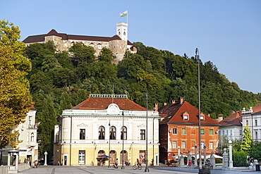 The Slovenian Philharmonic Hall in Congress Square, with Ljubljana Castle above, Ljubljana, Slovenia, Europe