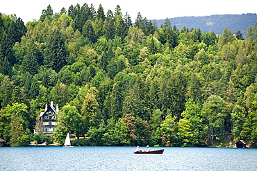 The forested shores of Lake Bled in the Julian Alps in northwest Slovenia, Europe