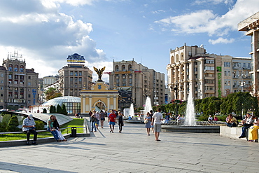 Pecerskyj gate and pedestrians in Independence Square (Maidan Nezalezhnosti) in Kiev, the capital of Ukraine, Europe