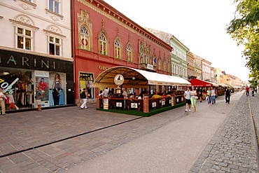 Shops lining a street with a tram line in the historic town of Kosice in eastern Slovakia.