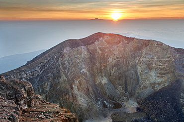 Sunrise seen from the summit of Gunung Agung (3142m), the highest volcano on the island of Bali, Indonesia.