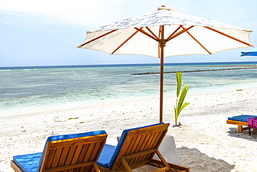 Beach loungers on Gili Air island, Indonesia.