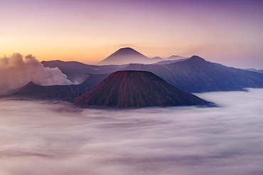 Dawn view of Mount Bromo (near left) and Gunung Semeru (centre background) in Bromo Tengger Semeru National Park, Indonesia.