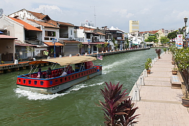 A boat on the Malacca River which flows through Malacca town, Malaysia.