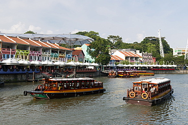 Boats on the Singapore river at Clarke Quay in Singapore.