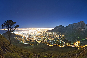 Table Mountain and the city of Cape Town in moonlight.