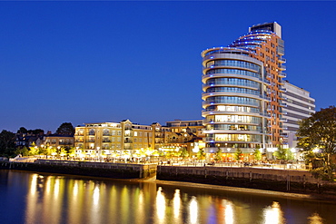 Dusk view of the Putney embankment and Putney Wharf Tower apartment block along the Thames River near Putney Bridge in west London.