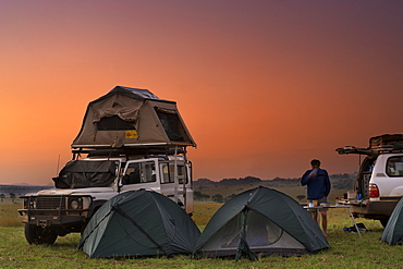 Land Rover Defender and tents at the campsite in Kidepo Valley National Park in northern Uganda.