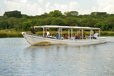 View of a tourist boat on the Victoria Nile River in Murchison Falls National Park in Uganda.