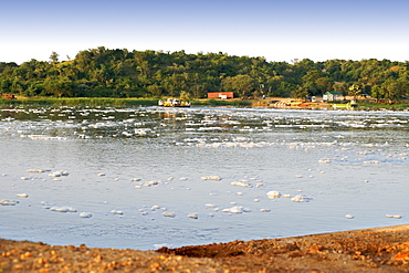 View of froth on the Victoria Nile River at the ferry crossing point in Murchison Falls National Park in Uganda.