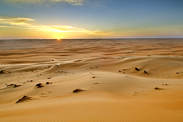 Sunset over Wahiba Sands (Ramlat al Wahaybah) in Oman.