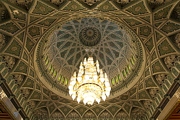 Chandelier and roof inside the prayer area of the Sultan Qaboos Grand Mosque in Muscat, the capital of Oman.