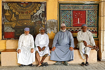 Omani men sitting in the Mutrah souk in Muscat, the capital of the sultanate of Oman.