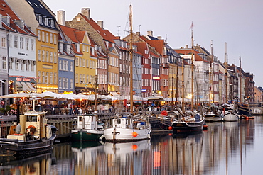 Boats and sidewalk cafes along the Nyhavn canal, Copenhagen, Denmark, Scandinavia, Europe