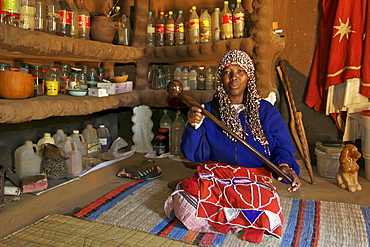 Aleta Thamae, a traditional sangoma posing in her consultation room in her house in the township of Refilwe near Cullinan in South Africa.