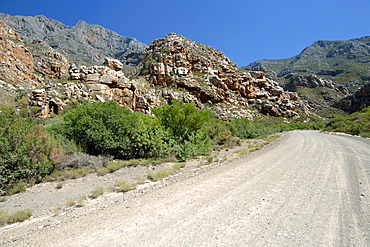 A gravel road leading through the Groot Swartberge mountain range between Calitzdorp and Laingsburg in South Africa's western Cape province.