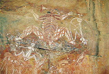 Namondjok (centre) who ate his clan sister, Namarrgon (right) , the Lightning Man and Barrginj his wife (below left) supernatural ancestors at the rock art site at Nourlangie Rock, Kakadu National Park, Northern Territory, Australia