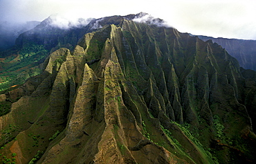 The towering eroded seacliffs of the famous NA PALI COAST seen by helicopter, the easiest way to see this inaccessible scenic wonder, Kauai, Hawaii, USA