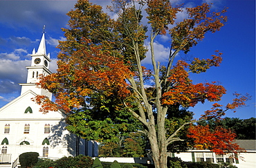 Church and autumn colours, part of the beautiful New England fall display, at a small town west of Boston, Massachusetts, USA