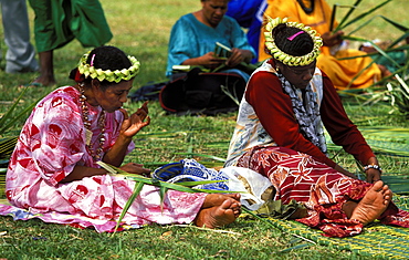 Women weaving traditional pandanus mat at a Melanesian cultural festival, Efate Island, Port Vila, Vanuatu