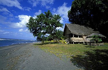 Bamboo beach hut on volcanic 'black sand' beach in East Tanna near Mt Yasur, one of the Pacific's most active volcanoes, Tanna Island, Vanuatu